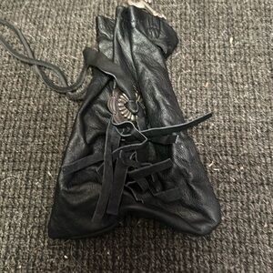 Motorcycle purse.   Ties to hold together